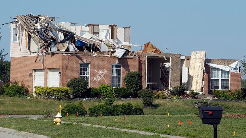 A tornado-damaged home in Trotwood’s Moss Creek development. Many homes in this former golf course were destroyed by the Memorial Day tornadoes. This photo was taken in late July. TY GREENLEES / STAFF