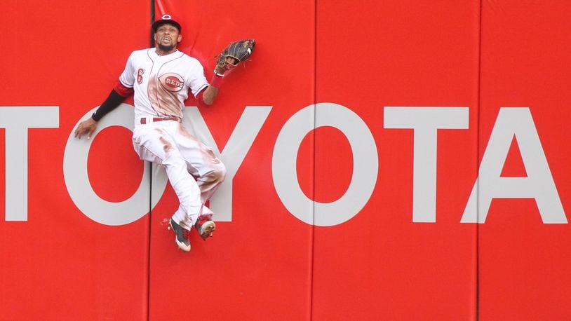 Reds center fielder Billy Hamilton makes a catch against the Brewers on Thursday, April 13, 2017, at Great American Ball Park in Cincinnati. David Jablonski/Staff