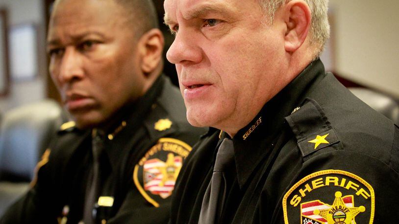 Montgomery County Sheriff Phil Plummer, foreground, and Major Daryl Wilson at a press conference last year. A mother and daughter who worked in the sheriff’s office are no longer with the department after a pending criminal investigation. FILE