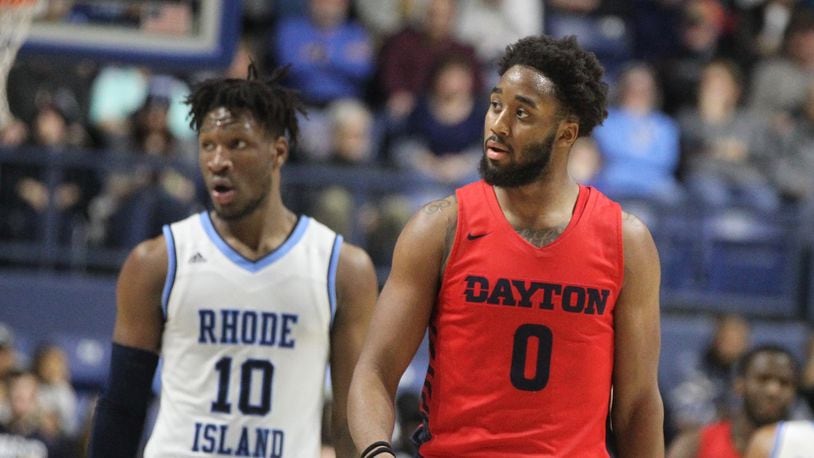 Dayton’s Josh Cunningham heads back down the court during a game against Rhode Island on Saturday, Feb. 9, 2019, at the Ryan Center in Kingston, R.I. David Jablonski/Staff