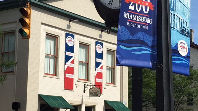 Businesses and organizations in and around downtown Miamisburg are showing bicentennial spirit this week in anticipation of the eight-day celebration that kicks off Saturday. NICK BLIZZARD/STAFF