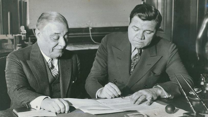 Babe Ruth, right, of the New York Yankees, signs his 1934 contract with Jacob Ruppert, who owned the team, in New York on Jan. 14, 1934. Under Ruppert's ownership, the Yankees won seven World Series, and he oversaw the addition of Ruth and Lou Gehrig to the team. (The New York Times)