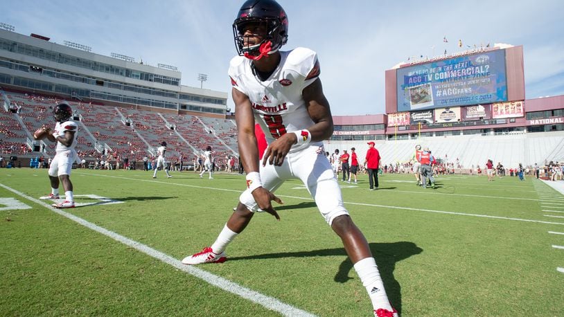 TALLAHASSEE, FL - OCTOBER 21: Quarterback Lamar Jackson #8 of the Louisville Cardinals warms up prior to their game against the Florida State Seminoles at Doak Campbell Stadium on October 21, 2017 in Tallahassee, Florida. (Photo by Michael Chang/Getty Images)
