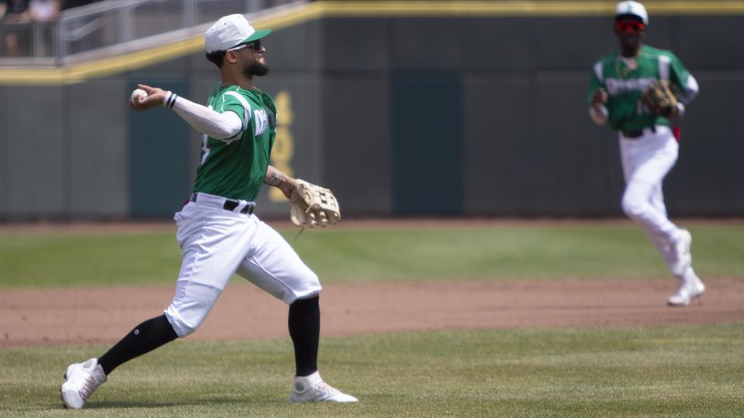 Dragons third baseman J.V. Martinez throws out a runner on a ground ball during the second inning of Sunday's game against West Michigan at DayAir Ballpark. Jeff Gilbert/CONTRIBUTED