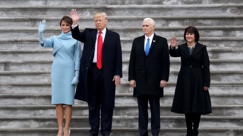 WASHINGTON, DC - JANUARY 20: First Lady Melania Trump, President Donald Trump, Vice President Mike Pence and Karen Pence wave goodbye to Barack and Michelle Obama on the West Front of the U.S. Capitol on January 20, 2017 in Washington, DC. In today's inauguration ceremony Donald J. Trump becomes the 45th president of the United States. (Photo by Rob Carr/Getty Images)