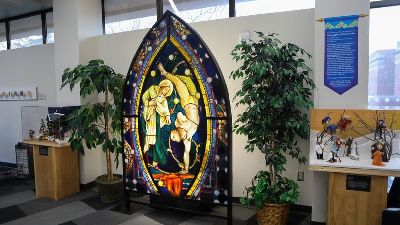 This stained glass window was donated to the Marian Library in honor of the current juggling exhibit. It’s titled “The Juggler of Notre Dame” by Jeffrey Miller.  CONTRIBUTED