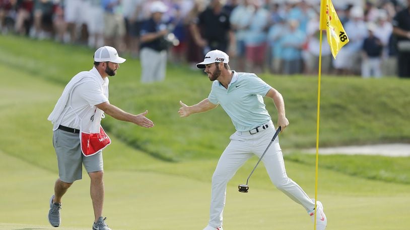 BLAINE, MINNESOTA - JULY 07: Matthew Wolff of the United States celebrates with his caddie, Steve Lohmeyer, after making a eagle putt on the 18th green to win the 3M Open at TPC Twin Cities on July 07, 2019 in Blaine, Minnesota. (Photo by Michael Reaves/Getty Images)