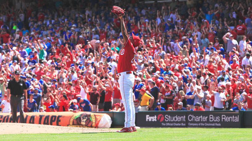 Reds closer Raisel Iglesias celebrates after the final out of a victory against the Cubs on Sunday, June 24, 2018, at Great American Ball Park in Cincinnati. David Jablonski/Staff
