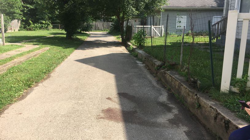 Middletown police said Kenneth Roesch, of Middletown, allegedly stabbed Carlton Brock, of Middletown, several times in the torso Friday night in this alley on Arlington Avenue. RICK McCRABB/STAFF
