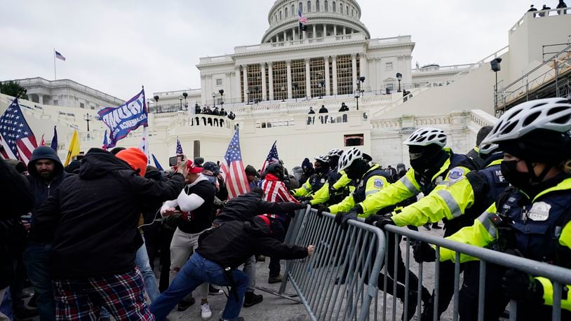 FILE - Rioters loyal to President Donald Trump rally at the U.S. Capitol in Washington on Jan. 6, 2021. (AP Photo/Julio Cortez, File)