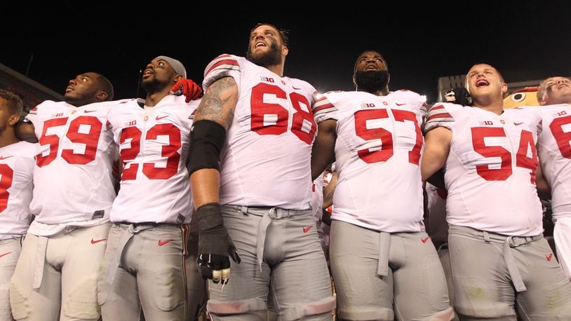 Taylor Decker (68) is shown with other Ohio State players in 2015. Decker is a Vandalia High School graduate. DAVID JABLONSKI/STAFF