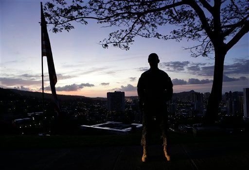 A Marine stands post at dawn prior to the Memorial Service for Sen. Daniel Inouye, D-Hawaii.