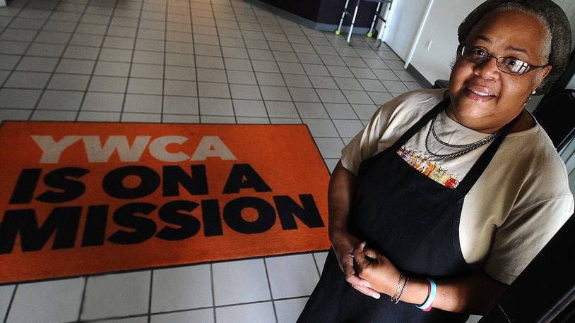 Sheila Casey works in the kitchen at the YWCA in Dayton. MARSHALL GORBY\STAFF