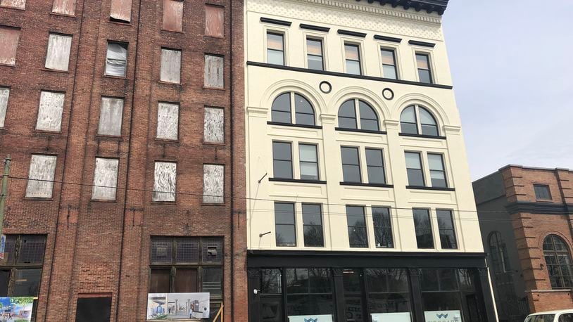 The Avant-Garde at 607 E. Third St. has welcomed a new tenant, JJR Solutions, a defense contractor. The company has committed to bringing 100 jobs downtown in the next three years. CORNELIUS FROLIK / STAFF