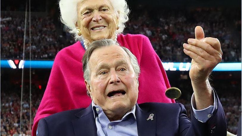 President George H.W. Bush, shown here with his wife Barbara, died Friday at age 94 in Houston.