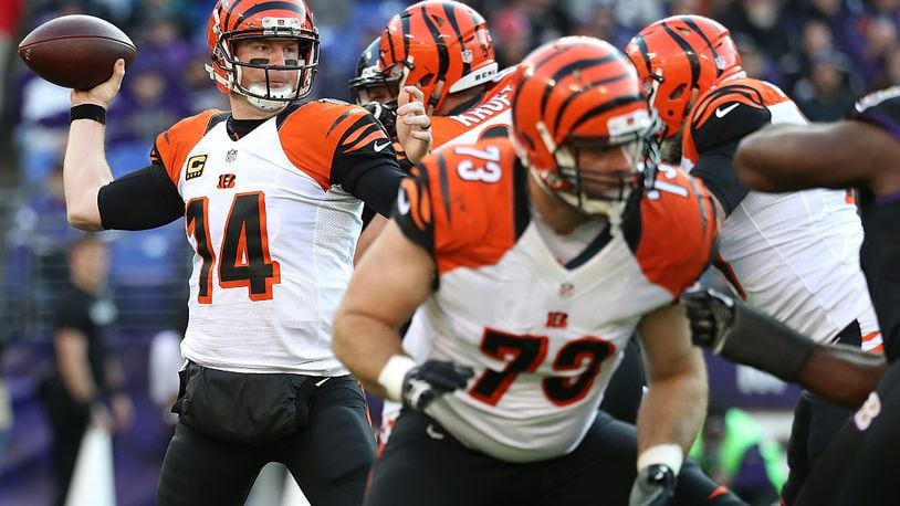 BALTIMORE, MD - NOVEMBER 27: Quarterback Andy Dalton #14 of the Cincinnati Bengals passes the ball while tackle Eric Winston #73 of the Cincinnati Bengals defends against the Baltimore Ravens in the third quarter at M&T Bank Stadium on November 27, 2016 in Baltimore, Maryland. (Photo by Rob Carr/Getty Images)