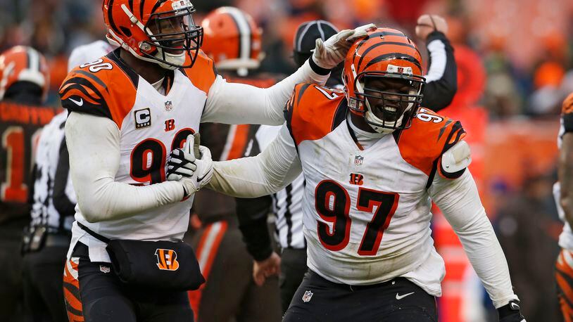 Cincinnati Bengals defensive tackle Geno Atkins (97) is congratulated after a sack in the second half of an NFL football game against the Cleveland Browns, Sunday, Dec. 11, 2016, in Cleveland. (AP Photo/Ron Schwane)