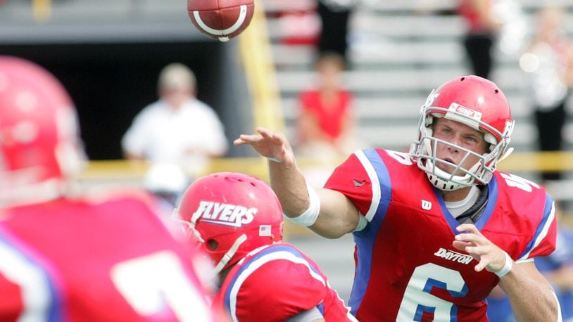 Kevin Hoyng, the quarterback for the Dayton Flyers, throws a pass against Urbana University at Welcome Stadium. DDN FILE
