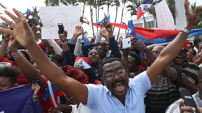 People join together, near the Mar-a-Lago resort where President Donald Trump spent the last few days,  to condemn President Trumps reported statement about immigrants from Haiti and to ask that he apologize to them on January 15, 2018 in West Palm Beach, Florida. President Trump is reported to have called Haiti, Africa and El Salvador places "shithole countries" last week, whose inhabitants are not desirable for U.S. immigration.
