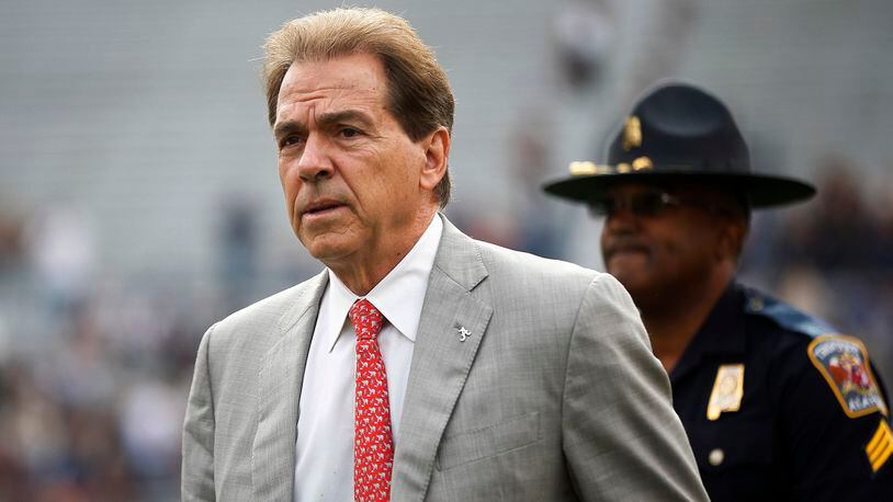 FILE - In this Nov. 25, 2017, file photo, Alabama head coach Nick Saban walks the field before the Iron Bowl NCAA college football game against Auburn, in Auburn, Ala. The Associated Press voters prefer Alabama over Ohio State. In the final Top 25 of the regular season, the Crimson Tide was No. 4 and the Buckeyes were No. 5. (AP Photo/Brynn Anderson, File)