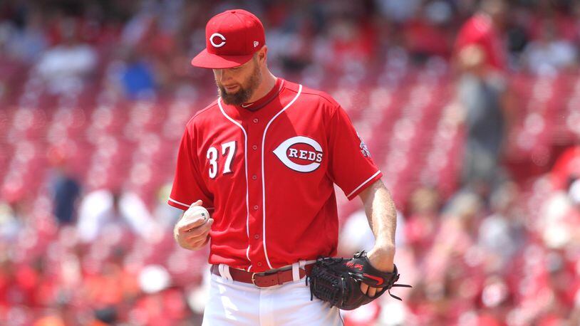 Reds pitcher Scott Feldman eyes the baseball during a start against the Nationals on Sunday, July 16, 2017, at Great American Ball Park in Cincinnati.