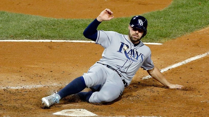 CHICAGO, IL - SEPTEMBER 29: Curt Casali #19 of the Tampa Bay Rays slides into home to score on a sacrifice fly by Evan Longoria #3 (not pictured) during the seventh inning at U.S. Cellular Field on September 29, 2016 in Chicago, Illinois. The Tampa Bay Rays won 5-3. (Photo by Jon Durr/Getty Images)