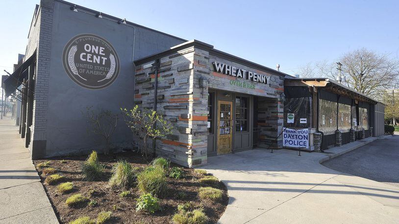 Wheat Penny Oven and Bar has closed its indoor dining temporarily but still has its heated patio dining area open, along with carry-out and delivery options for customers. MARSHALL GORBY/STAFF