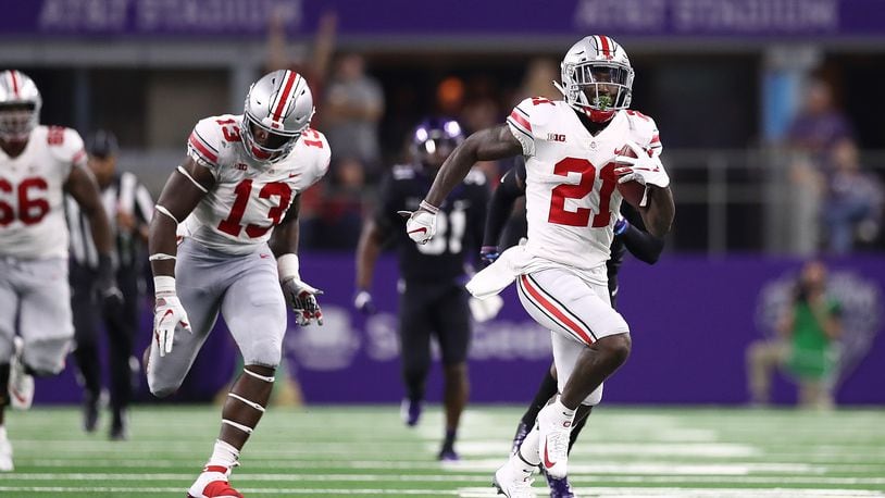 ARLINGTON, TX - SEPTEMBER 15:  Parris Campbell #21 of the Ohio State Buckeyes runs for a touchdown against the TCU Horned Frogs in the third quarter during The AdvoCare Showdown at AT&T Stadium on September 15, 2018 in Arlington, Texas.  (Photo by Ronald Martinez/Getty Images)