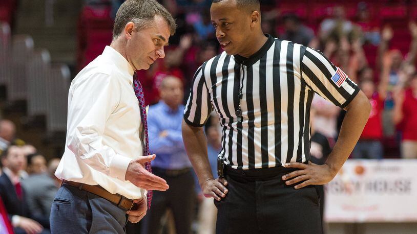 Ball State coach James Whitford wants an explanation from official Edwin Young, a former Flyer, during a game. DOMENIC CENTOFANTI / BALL STATE CREATIVE SERVICES