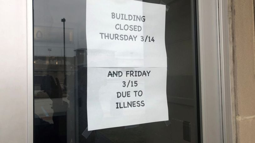 A sign on the door at Northridge High School says the school is closed for two days due to a large number of students out with the flu and other illnesses. STAFF
