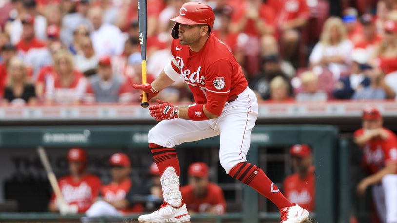 Cincinnati Reds' Joey Votto watches his RBI-single during the sixth inning of a baseball game against the Baltimore Orioles in Cincinnati, Sunday, July 31, 2022. (AP Photo/Aaron Doster)