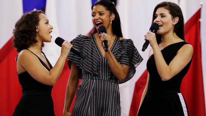 Singers of the cast of Hamilton, Phillipa Soo, right, Rene Elise Goldsberry, center, and Jasmine Cephas Jones, sing "America the Beautiful" before the NFL Super Bowl 51 football game between the New England Patriots and the Atlanta Falcons, Sunday, Feb. 5, 2017, in Houston. (AP Photo/Matt Slocum)