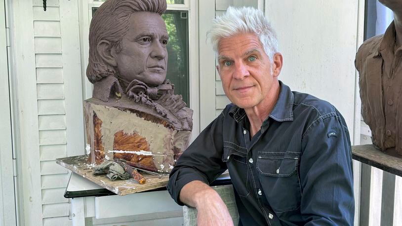 Artist Kevin Kresse, is shown with a clay bust of Johnny Cash, April 23, 2024 in Little Rock, Ark. Kresse's full sculpture of Cash will be unveiled at the U.S. Capitol as part of the Statuary Hall collection, later this year. (AP Photo/Mike Pesoli)