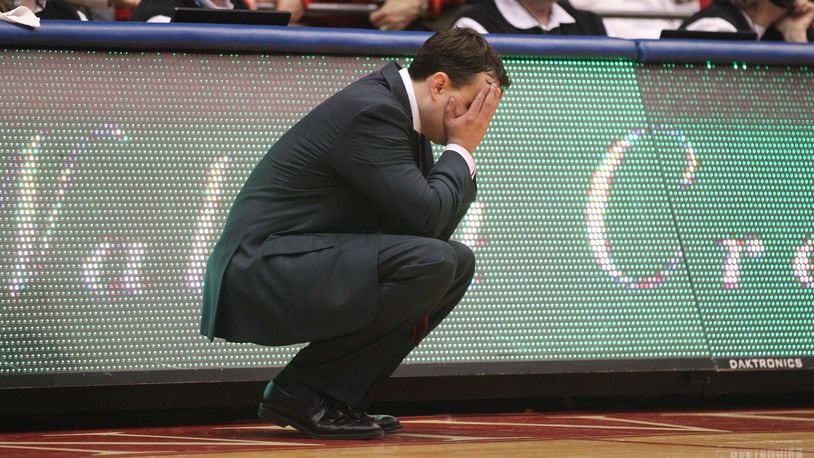 Archie Miller covers his eyes during a game against Virginia Commonwealth on March 1, 2017. David Jablonski/Staff