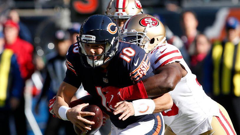 CHICAGO, IL - DECEMBER 03: Quarterback Mitchell Trubisky #10 of the Chicago Bears is sacked by Elvis Dumervil #58 of the San Francisco 49ers in the first quarter at Soldier Field on December 3, 2017 in Chicago, Illinois. The San Francisco 49ers defeated the Chicago Bears 15-14. (Photo by Kena Krutsinger/Getty Images)