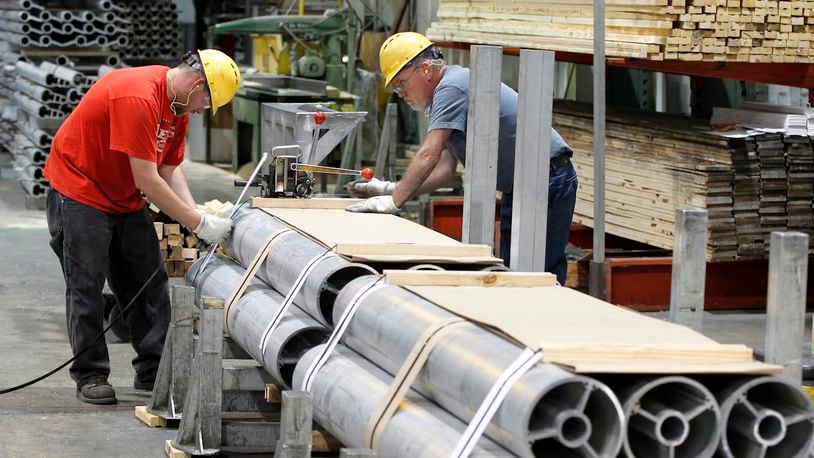 Magnode Corporation employees band extruded aluminum at the company’s Trenton plant in 2012. STAFF FILE PHOTO