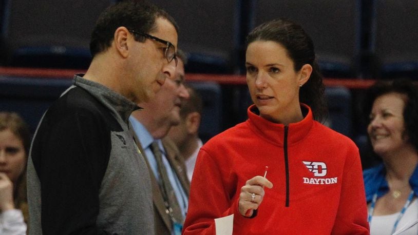 Dayton head coach Jim Jabir, left, and assistant coach Shauna Green talk during practice on Friday, March 27, 2015, at the Times Union Center in Albany, N.Y. David Jablonski/Staff