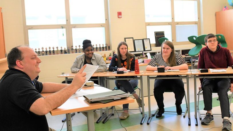 David Jones, left, a teacher at Northmont High School, works with some of the members of the school’s highly successful academic challenge, or quiz bowl, team during a recent after school practice.