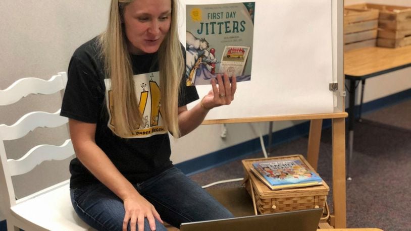 Centerville first-grade teacher Christina Ryan reads an appropriate book to her online students on the first day of school. SUBMITTED PHOTO
