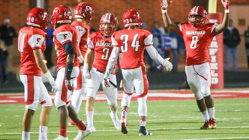 Fairfield running back James Mitchell (8) celebrates after returning a punt for a touchdown during a Division I playoff game against St. Xavier at Fairfield Stadium on Nov. 4, 2016. GREG LYNCH/STAFF