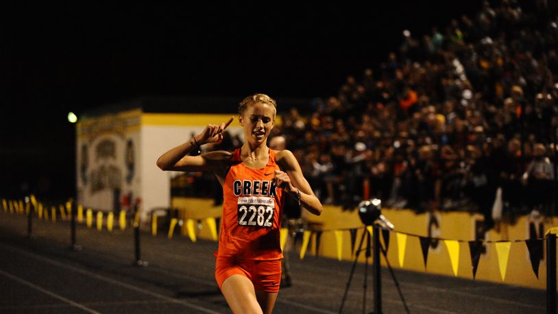 Beavercreek’s Taylor Ewert celebrates her win in the Saturday Night Lights event at Centerville. Greg Billing/CONTRIBUTED