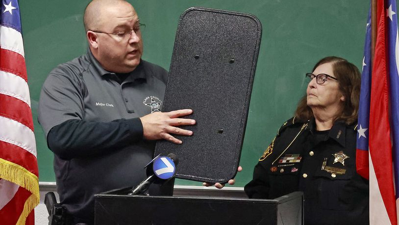Clark County Sheriff Deb Burchett and Maj. Chris Clark talk about the new ballistic shields they were able to supply to every member of their department thanks in part to a fundraiser at Brandeberry Winery  in Enon.  BILL LACKEY/STAFF