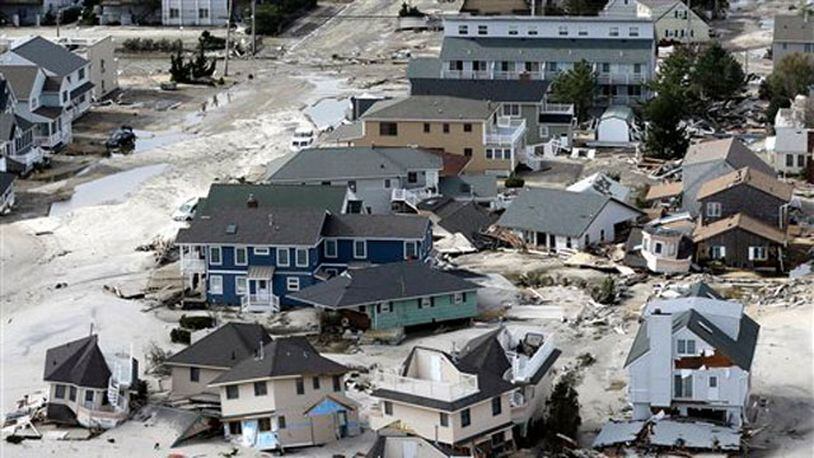 This aerial photo shows destroyed houses left in the wake of superstorm Sandy on Wednesday, Oct. 31, 2012, in Seaside Heights, N.J. (AP Photo/Mike Groll)