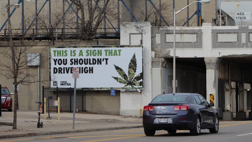 A billboard on South Jefferson Street in downtown Dayton warns motorists against driving stoned on marijuana. Critics of marijuana decriminalization say they fear removing penalties for pot possession can lead to more impaired driving and other public safety concerns. CORNELIUS FROLIK / STAFF