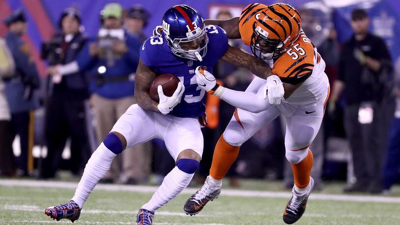 Bengals linebacker Vontaze Burfict, seen here tackling running back Giants running back Rashad Jennings last November 14 in a game at MetLife Stadium, has pleased team officials by working himself into excellent shape.