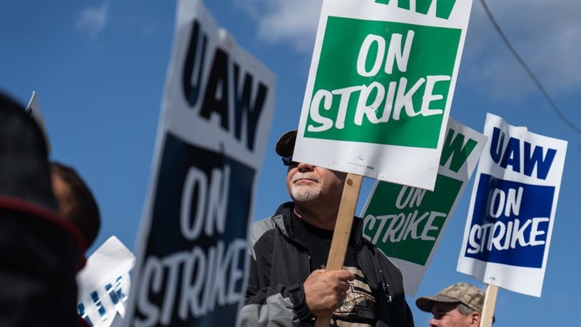 UAW members stand on the picket line outside the General Motors Flint Assembly plant earlier this month as they remain on strike from General Motors. (Ryan Garza/Detroit Free Press/TNS)