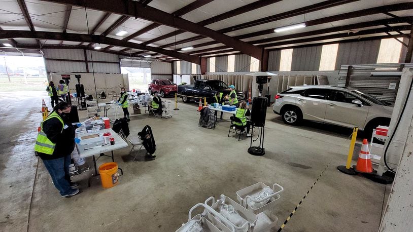 The Butler County General Health District held a drive through COVID-19 vaccination clinic Wednesday, March 17, 2021 at Butler County Fairgrounds in Hamilton. Nearly 75 workers and volunteers administered 1500 vaccines during the event.  NICK GRAHAM / STAFF