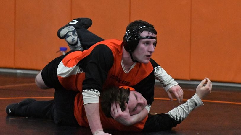 Beavercreek's Riley Martin (top) put in practice time on the mat in preparation for the Beavers' season opener. Greg Billing/Contributed