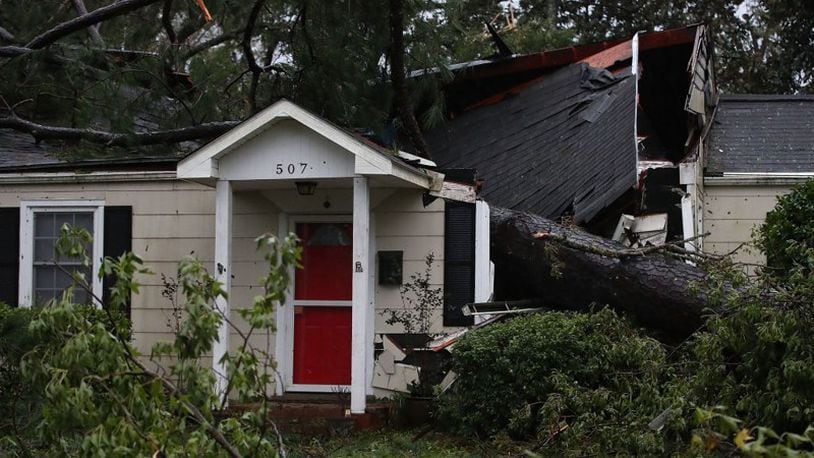WILMINGTON, NC - SEPTEMBER 16: A home is damaged after a large tree fell on it on September 16, 2018 in Wilmington, North Carolina. Hurricane Florence hit Wilmington as a category 1 storm causing widespread damage and flooding across North Carolina [Photo by Mark Wilson/Getty Images]