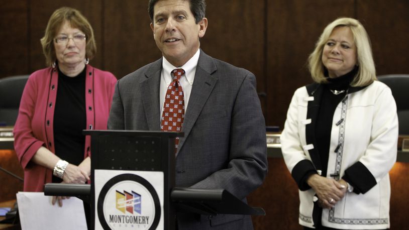 Joe Tuss (center) was appointed as Montgomery County Administrator in 2012. At left is Montgomery County Commissioner Judy Dodge and at right is Montgomery County Commissioner Debbie Lieberman. STAFF PHOTO BY LISA POWELL